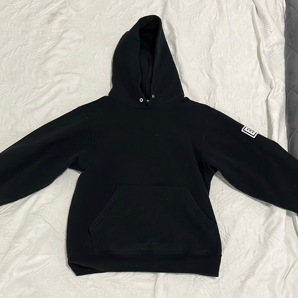 black hoodie with USO logo